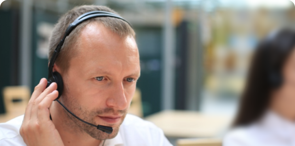 interpreter wearing headset concentrates while rendering simultaneous interpretation